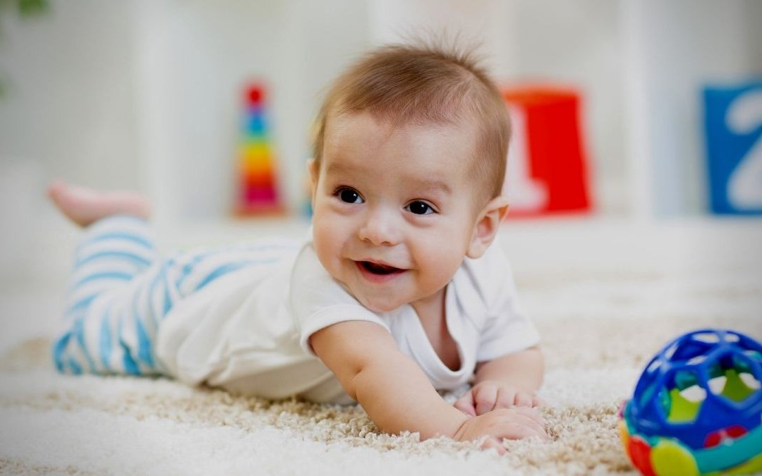 A Happy Baby In An Indoor Baby Play Area