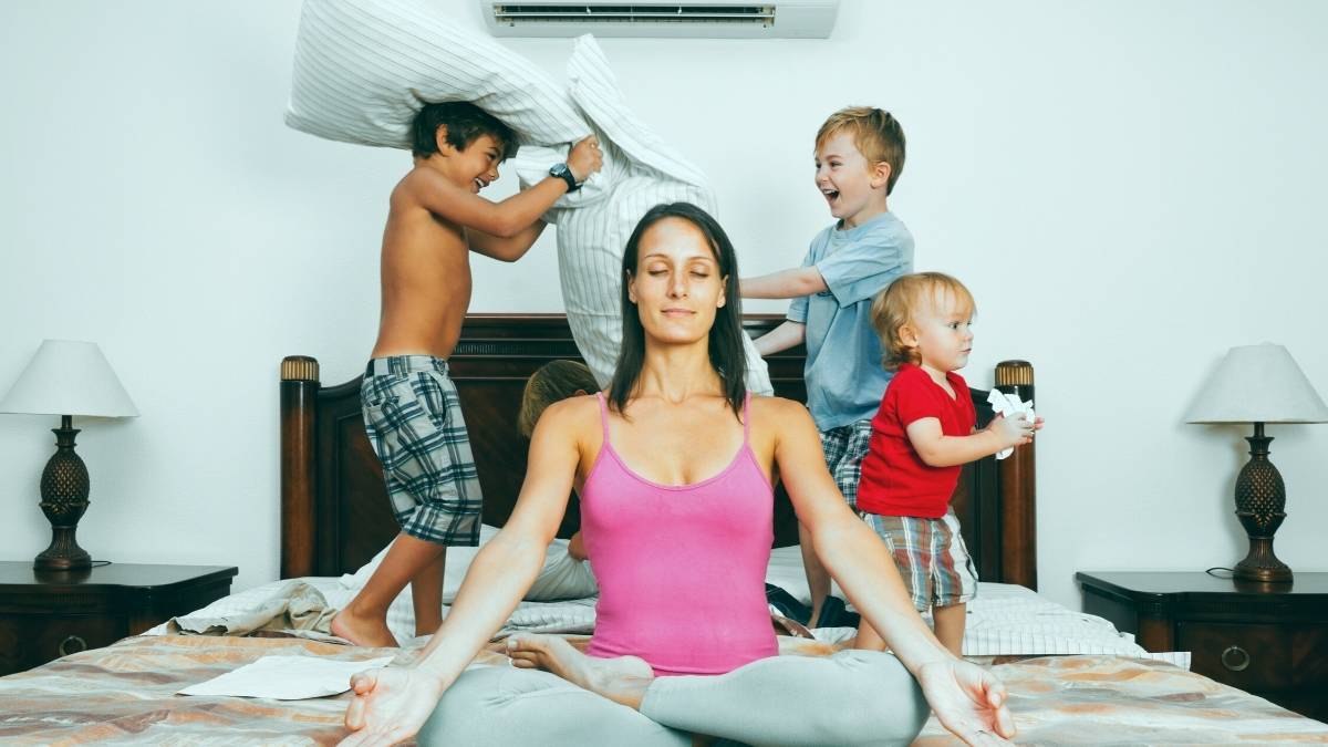 a calm parent in front of three hyper active kids