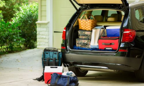 Pack up things in car to make family road trip fun