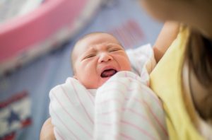 a baby crying having a colic - best home remedies for colic
