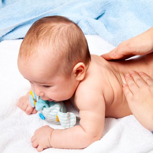 home remedies for colic - massage baby to soothe pain