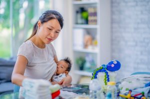 Asian mom breastfeeding while working - advice for new moms