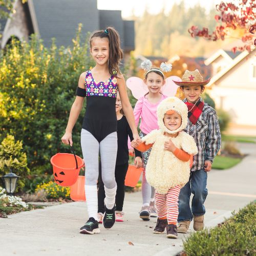 toddlers trick-or-treating for halloween 