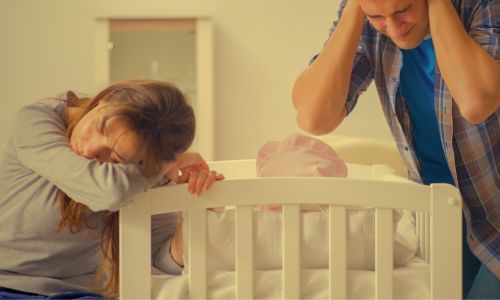 stressed parents with new baby